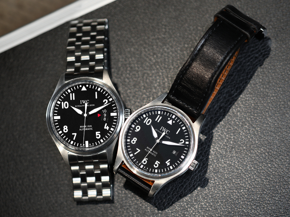IWC Mark series pilot watches on steel bracelet and leather strap side by side